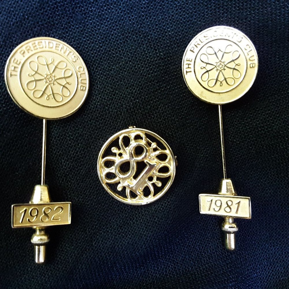Set of Avon Award pins
